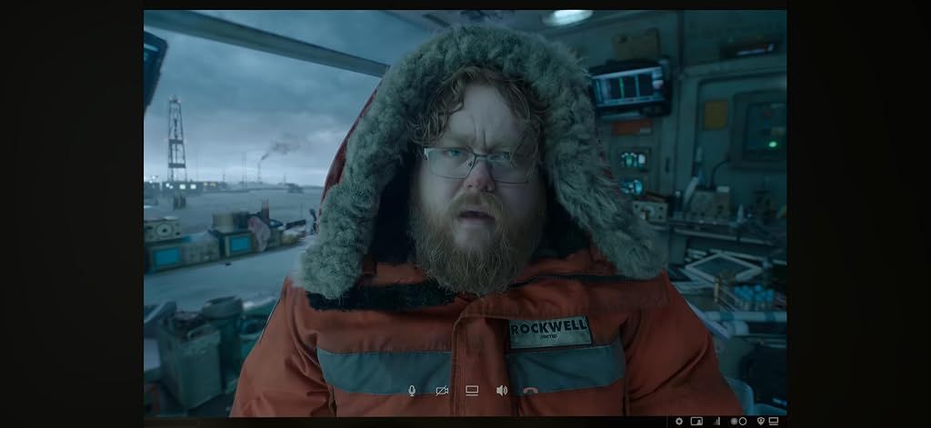 Photo from the movie, showing the scientist in an orange jacket in an otherwise cold, blue scene
